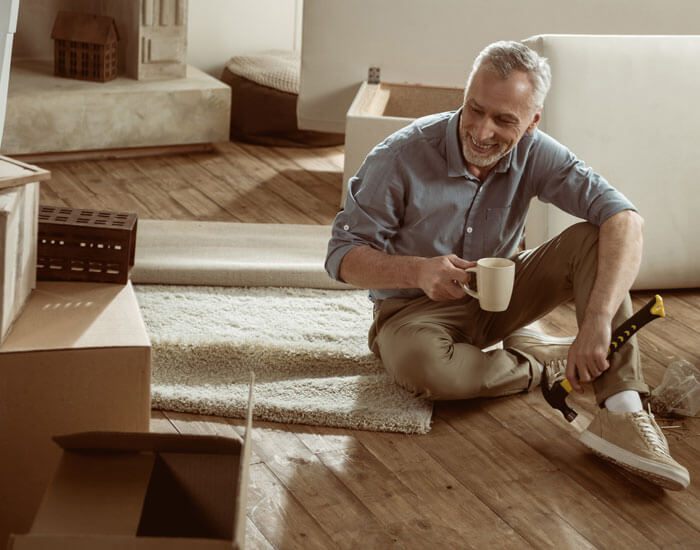 Man sitting on floor with coffee cup